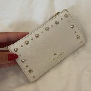 Kate spade wallet in white with nice details!